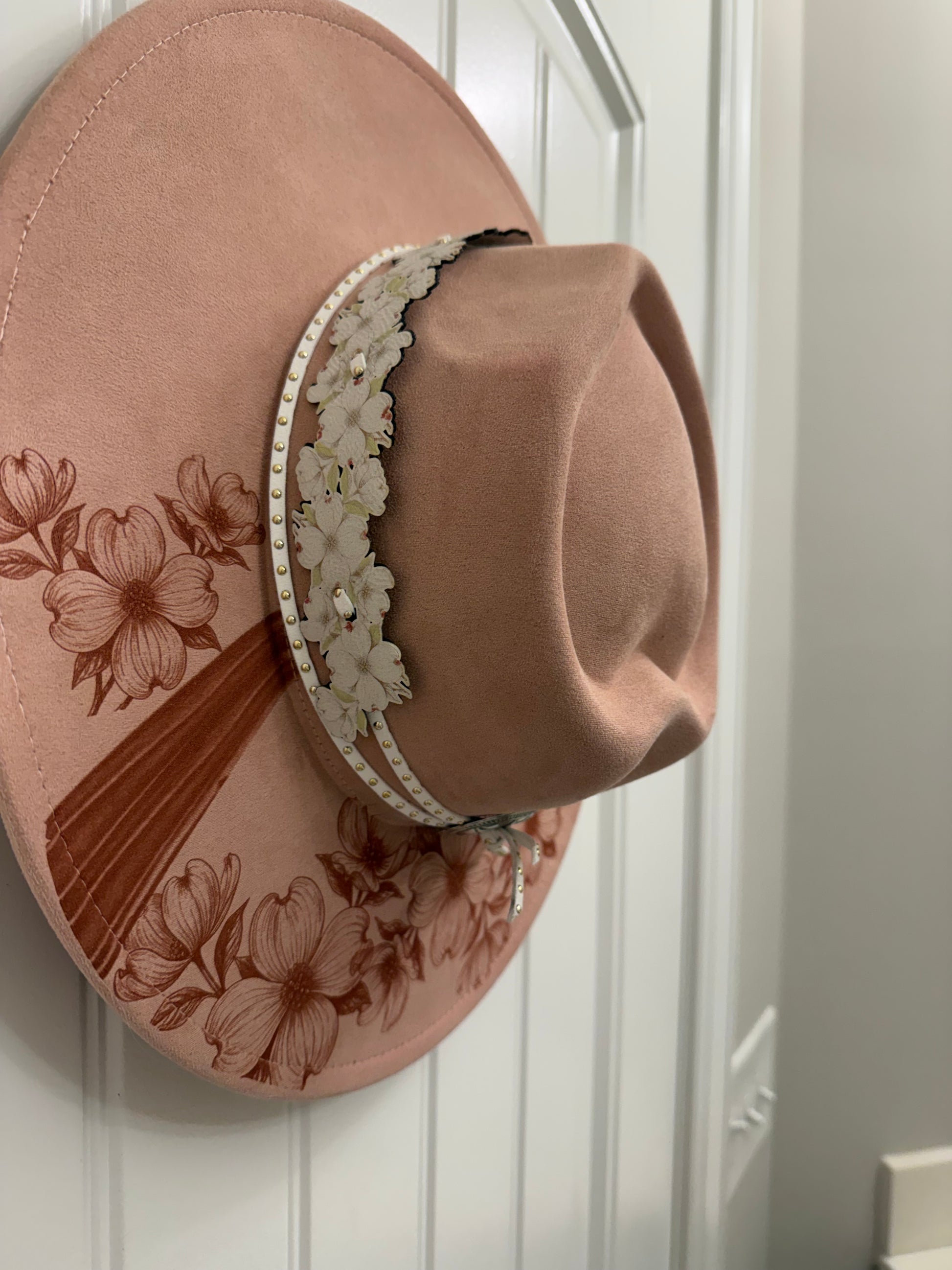 Beautiful cardinal hanging out on a branch of a Dogwood tree made by Beach Vibes NC/Crystal Coast Cowgirl Set of 3 items large brim faux suede heart shaped hat, large faux suede pink handbag and makeup bag.