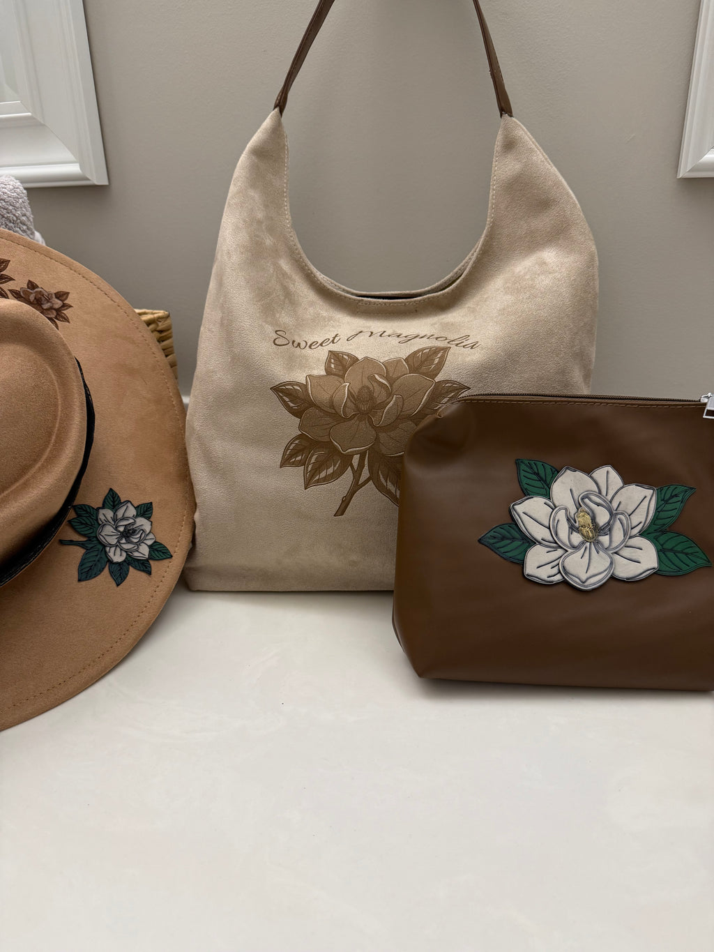 Sweet Magnolia designed by Beach Vibes NC/Crystal Coast Cowgirl     Set includes: large brim faux suede hat,          large handbag and large makeup bag.